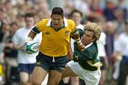 27 June 2004; Henari Veratu, Australia, in action against Wynand Olivier, South Africa. IRB U21 World Championship 3rd/4th place play-off Australia v South Africa, Hughenden, Glasgow, Scotland. Picture credit; Brendan Moran / SPORTSFILE