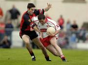 3 July 2004; Brian Dooher, Tyrone, in action against Adrian Scullion, Down. Bank of Ireland Football Championship Qualifier, Round 2, Down v Tyrone, Pairc an Iuir, Newry, Co. Down. Picture credit; Damien Eagers / SPORTSFILE