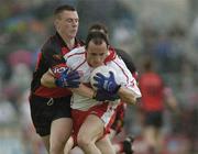 3 July 2004; Brian Dooher, Tyrone, in action against John Clarke, Down. Bank of Ireland Football Championship Qualifier, Round 2, Down v Tyrone, Pairc an Iuir, Newry, Co. Down. Picture credit; Damien Eagers / SPORTSFILE