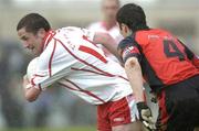 3 July 2004; Stephen O'Neill, Tyrone, in action against Adrian Scullion, Down. Bank of Ireland Football Championship Qualifier, Round 2, Down v Tyrone, Pairc an Iuir, Newry, Co. Down. Picture credit; Damien Eagers / SPORTSFILE