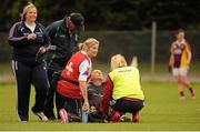 1 September 2013; Referee Colm McManus, receives attention after injuring himself. All-Ireland Ladies Football Junior Championship, Semi-Final, Louth v Wexford, Clane GAA Club, Clane, Co. Kildare. Picture credit: Tomas Greally / SPORTSFILE