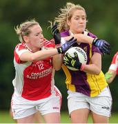 1 September 2013; Katie Redmond, Wexford, in action against Marie O'Connell, Louth. All-Ireland Ladies Football Junior Championship, Semi-Final, Louth v Wexford, Clane GAA Club, Clane, Co. Kildare. Picture credit: Tomas Greally / SPORTSFILE
