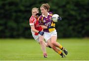 1 September 2013; Ellen O'Brien, Wexford, in action against Marie O'Connell, Louth. All-Ireland Ladies Football Junior Championship, Semi-Final, Louth v Wexford, Clane GAA Club, Clane, Co. Kildare. Picture credit: Tomas Greally / SPORTSFILE