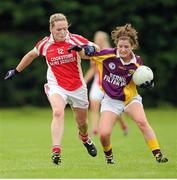 1 September 2013; Ellen O'Brien, Wexford, in action against Marie O'Connell, Louth. All-Ireland Ladies Football Junior Championship, Semi-Final, Louth v Wexford, Clane GAA Club, Clane, Co. Kildare. Picture credit: Tomas Greally / SPORTSFILE