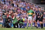 1 September 2013; Dublin captain Stephen Cluxton and Kerry captain Colm Cooper shake hands in the company of referee Cormac Reilly before the match. GAA Football All-Ireland Senior Championship, Semi-Final, Dublin v Kerry, Croke Park, Dublin. Picture credit: Brian Lawless / SPORTSFILE