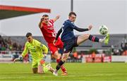 4 August 2023; Conor Carty of St Patrick's Athletic in action against Garry Buckley of Sligo Rovers, centre, and Luke McNicholas during the SSE Airtricity Men's Premier Division match between Sligo Rovers and St Patrick's Athletic at The Showgrounds in Sligo. Photo by Tyler Miller/Sportsfile