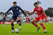 4 August 2023; Jake Mulraney of St Patrick's Athletic in action against Niall Morahan of Sligo Rovers during the SSE Airtricity Men's Premier Division match between Sligo Rovers and St Patrick's Athletic at The Showgrounds in Sligo. Photo by Tyler Miller/Sportsfile