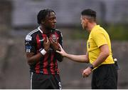 4 August 2023; Jonathan Afolabi of Bohemians is spoken to by referee Rob Hennessy during the SSE Airtricity Men's Premier Division match between Bohemians and Drogheda United at Dalymount Park in Dublin. Photo by Seb Daly/Sportsfile