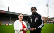 10 August 2023; SSE Airtricity marketing specialist Ruth Rapple presents Jonathan Afolabi of Bohemians with his SSE Airtricity / SWI Player of the Month award for July 2023 at Dalymount Park in Dublin. Photo by Harry Murphy/Sportsfile