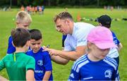 9 August 2023; Leinster player Liam Turner signs autographs for participants during the Bank of Ireland Leinster Rugby Summer Camp at MU Barnhall RFC in Leixlip, Kildare. Photo by Piaras Ó Mídheach/Sportsfile