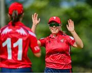 10 August 2023; Arlene Kelly of Dragons, left, celebrates with teammate Zara Craig after catching out Sarah Forbes of Typhoons during the Evoke Super 50 Cup match between Dragons and Typhoons at The Hills Cricket Club in Dublin. Photo by Tyler Miller/Sportsfile