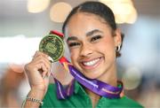 11 August 2023; Ireland's Elizabeth Ndudi poses for a photograph at Dublin Airport after returning from the U20 European Athletics Championships in Jerusalem where she won gold in the women's long jump event. Photo by Stephen McCarthy/Sportsfile