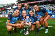 13 August 2023; Dublin players, from left, Chloe Darby, Kate Sullivan, Jodi Egan, Orla Martin, Faye O'Connell Bell and Niamh Hetherton with 7 month old Billie Rice after the 2023 TG4 LGFA All-Ireland Senior Championship Final match between Dublin and Kerry at Croke Park in Dublin. Photo by Ramsey Cardy/Sportsfile