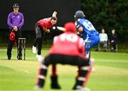 17 August 2023; Liam McCarthy of Munster Reds delivers to Chris de Freites of Leinster Lightning during the Rario Inter-Provincial Cup match between Munster Reds and Leinster Lightning at The Mardyke in Cork. Photo by Eóin Noonan/Sportsfile