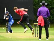 17 August 2023; Josh Manley of Munster Reds delivers to Cormac McLoughlin-Gavin of Leinster Lightning during the Rario Inter-Provincial Cup match between Munster Reds and Leinster Lightning at The Mardyke in Cork. Photo by Eóin Noonan/Sportsfile
