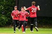 17 August 2023; Josh Manley of Munster Reds celebrates with team-mates after bowling out Cormac McLoughlin-Gavin of Leinster Lightning during the Rario Inter-Provincial Cup match between Munster Reds and Leinster Lightning at The Mardyke in Cork. Photo by Eóin Noonan/Sportsfile