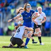 19 August 2023; Ruth Campbell of Leinster is tackled by Ella Durkan of Ulster during the Vodafone Women’s Interprovincial Championship match between Leinster and Ulster at Energia Park in Dublin. Photo by Ben McShane/Sportsfile