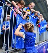 19 August 2023; Jess Keating of Leinster signs an autograph for a supporter after the Vodafone Women’s Interprovincial Championship match between Leinster and Ulster at Energia Park in Dublin. Photo by Ben McShane/Sportsfile
