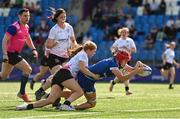 19 August 2023; Usha Daly-O'Toole of Leinster scores her side's fourth try despite the tackle of Niamh Barrett of Ulster during the Girl’s Interprovincial Championship match between Leinster and Ulster at Energia Park in Dublin. Photo by Ben McShane/Sportsfile