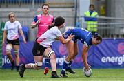 19 August 2023; Niamh Murphy of Leinster scores her side's fourth try despite the tackle of Olivia McKinley of Ulster during the Girl’s Interprovincial Championship match between Leinster and Ulster at Energia Park in Dublin. Photo by Ben McShane/Sportsfile