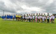 19 August 2023; The teams and refereeing officials line up for the playing of Amhrán na bhFiann before the FAI Women’s Amateur Shield Final 2023 match between St Patrick’s CYFC and Wilton United at Newhill Park in Two Mile Borris, Tipperary. Photo by Tom Beary/Sportsfile