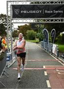 20 August 2023; Michael Harty of East Cork AC, crosses the line to win the Peugeot Race Series Cork City 10 Mile at Cork City in Cork. Photo by Eóin Noonan/Sportsfile