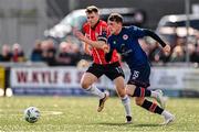 20 August 2023; Conor Carty of St Patrick's Athletic in action against Cameron McJannet of Derry City during the Sports Direct Men’s FAI Cup Second Round match between Derry City and St Patrick’s Athletic at The Ryan McBride Brandywell Stadium in Derry. Photo by Ben McShane/Sportsfile