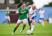 22 August 2023; Leah McGrath of Republic of Ireland in action against Margreta Elisdóttir í Bou of Faroe Islands during a women's U16 international friendly match between Republic of Ireland and Faroe Islands at Head in the Game Park in Drogheda, Louth. Photo by Ben McShane/Sportsfile