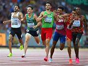 22 August 2023; John Fitzsimons of Ireland, second from left, crosses the finish line to finsih fifth in the men's 800m heats during day four of the World Athletics Championships at the National Athletics Centre in Budapest, Hungary. Photo by Sam Barnes/Sportsfile