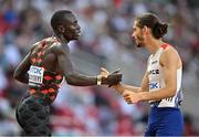 22 August 2023; Gabriel Tual of France, right, congratulates Emmanuel Wanyonyi of Kenya after he finishes first in the men's 800m heats during day four of the World Athletics Championships at the National Athletics Centre in Budapest, Hungary. Photo by Sam Barnes/Sportsfile