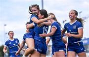 26 August 2023; Sophie Cullen of Leinster, 15, celebrates with team-mate Heidi Lyons after scoring her side's first try during the Girls Interprovincial Championship match between Leinster and Munster at Energia Park in Dublin. Photo by Piaras Ó Mídheach/Sportsfile