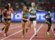 26 August 2023; Kelly McGrory of Ireland is passed the baton by Roisin Harrison while competing in the women's 4x400m relay heats during day eight of the World Athletics Championships at the National Athletics Centre in Budapest, Hungary. Photo by Sam Barnes/Sportsfile
