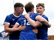 27 August 2023; Harley Fagan Harold of Leinster, centre, celebrates with team-mates Daragh Farrell, right, and Eoin Conlon after scoring his side's first try during the U18 Clubs Interprovincial Championship match between Leinster and Connacht at Energia Park in Dublin. Photo by Piaras Ó Mídheach/Sportsfile