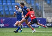 26 August 2023; Niamh Murphy of Leinster is tackled by Hannah Hehir of Munster during the Girls Interprovincial Championship match between Leinster and Munster at Energia Park in Dublin. Photo by Piaras Ó Mídheach/Sportsfile