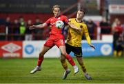 1 September 2023; Harry Wood of Shelbourne in action against Jamie Lennon of St Patrick's Athletic during the SSE Airtricity Men's Premier Division match between Shelbourne and St Patrick's Athletic at Tolka Park in Dublin. Photo by Seb Daly/Sportsfile