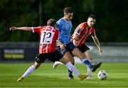 6 September 2023; Evan Osam of UCD in action against Derry City players Paul McMullan, left, and Ciarán Coll during the SSE Airtricity Men's Premier Division match between UCD and Derry City at UCD Bowl in Dublin. Photo by Ben McShane/Sportsfile