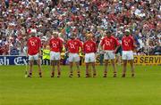 27 June 2004; Members of the Cork team stand for the national anthem. Guinness Munster Senior Hurling Championship Final, Cork v Waterford, Semple Stadium, Thurles, Co. Tipperary. Picture credit; Pat Murphy / SPORTSFILE
