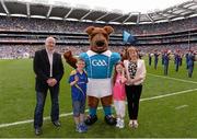 1 September 2013; James and Marie McLoughlin with eleven year old Devin and eight year old Saoirse, from Ardagh, Co. Longford, with Fionn the Irish Terrier, the GAA’s new official mascot, which was unveiled during the Dublin v Kerry - GAA Football All-Ireland Senior Championship Semi-Final. Croke Park, Dublin. Picture credit: Ray McManus / SPORTSFILE