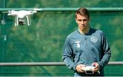 4 September 2013; Republic of Ireland's Seamus Coleman operates a quadcopter, with a video camera attached, at the end of squad training ahead of their 2014 FIFA World Cup Qualifier Group C game against Sweden on Friday. Republic of Ireland Squad Training, Gannon Park, Malahide, Co. Dublin. Picture credit: David Maher / SPORTSFILE