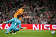 10 September 2023; Republic of Ireland goalkeeper Gavin Bazunu fouls Denzel Dumfries of Netherlands to concede a penalty during the UEFA EURO 2024 Championship qualifying group B match between Republic of Ireland and Netherlands at the Aviva Stadium in Dublin. Photo by Sam Barnes/Sportsfile