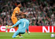 10 September 2023; Denzel Dumfries of Netherlands is tackled by Republic of Ireland goalkeeper Gavin Bazunu resulting in a penalty during the UEFA EURO 2024 Championship qualifying group B match between Republic of Ireland and Netherlands at the Aviva Stadium in Dublin. Photo by Sam Barnes/Sportsfile