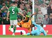 10 September 2023; Denzel Dumfries of Netherlands is tackled by Republic of Ireland goalkeeper Gavin Bazunu resulting in a penalty during the UEFA EURO 2024 Championship qualifying group B match between Republic of Ireland and Netherlands at the Aviva Stadium in Dublin. Photo by Stephen McCarthy/Sportsfile
