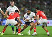 16 September 2023; Bundee Aki of Ireland in action against Tanginoa Halaifonua, left, and William Havili of Tonga during the 2023 Rugby World Cup Pool B match between Ireland and Tonga at Stade de la Beaujoire in Nantes, France. Photo by Brendan Moran/Sportsfile