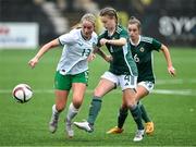 24 September 2023; Ceola Bergin of Republic of Ireland in action against Abi Sweetlove, centre, and Sarah Tweedie of Northern Ireland during the Women's U19 international friendly match between Northern Ireland and Republic of Ireland at Blanchflower Stadium in Belfast. Photo by Ben McShane/Sportsfile