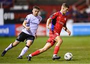 6 October 2023; Will Jarvis of Shelbourne in action against Archie Davies of Dundalk during the SSE Airtricity Men's Premier Division match between Shelbourne and Dundalk at Tolka Park in Dublin. Photo by Stephen McCarthy/Sportsfile