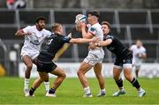 7 October 2023; Jude Postlethwaite of Ulster is tackled by Duncan Munn, left, and Kyle Rowe of Glasgow Warriors during the pre-season friendly match between Ulster and Glasgow Warriors at Kingspan Breffni in Cavan. Photo by Ben McShane/Sportsfile