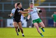 15 October 2023; Ryan Magill of Burren in action against Ryan Johnston of Kilcoo during the Down County Senior Club Football Championship final match between Burren and Kilcoo at Pairc Esler in Newry, Down. Photo by Ben McShane/Sportsfile