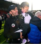 15 October 2023; Kilcoo manager Karl Lacey celebrates with son Naoise after the Down County Senior Club Football Championship final match between Burren and Kilcoo at Pairc Esler in Newry, Down. Photo by Ben McShane/Sportsfile