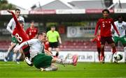 17 October 2023; Kaylem Harnett of Republic of Ireland has an attempt on goal despite the efforts of Leart Kabashi of Switzerland during the UEFA European U17 Championship qualifying group 10 match between Switzerland and Republic of Ireland at Turner's Cross in Cork. Photo by Eóin Noonan/Sportsfile