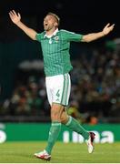 6 September 2013; Gareth McAuley, Northern Ireland, celebrates after scoring his side's first goal. 2014 FIFA World Cup Qualifier, Group F, Northern Ireland v Portugal, Windsor Park, Belfast.  Picture credit: Oliver McVeigh / SPORTSFILE